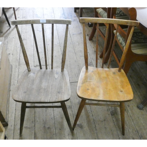 63 - A pair of Ercol spindle backed dining chairs with panel seats (need polishing)