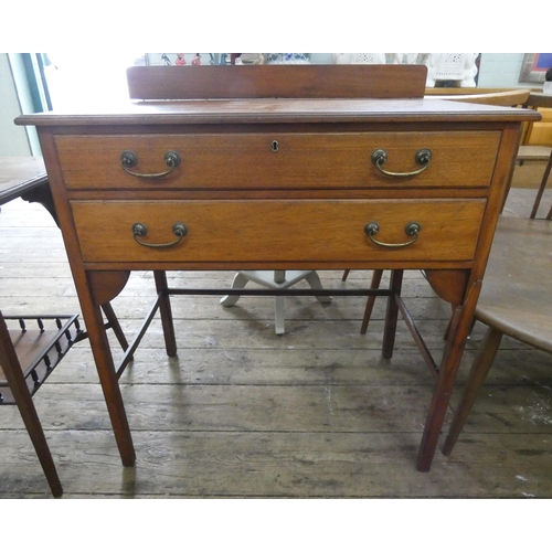 66 - An Edwardian mahogany chest of two drawers standing on square legs. 2'6