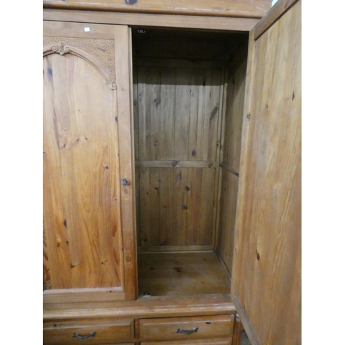 96A - A pine two door wardrobe with four drawers under. 50