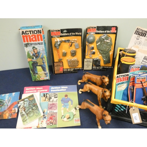 537 - A collection of vintage Action Man to include Action Man Helicopter pilot, outfits, guard dogs, miss... 