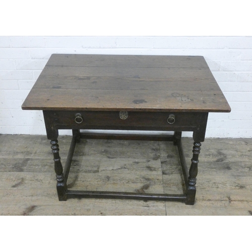 339 - An antique oak side table fitted one long drawer on a bobbin turned base and stretcher