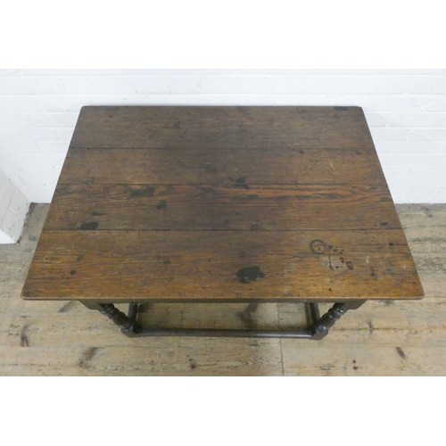 339 - An antique oak side table fitted one long drawer on a bobbin turned base and stretcher