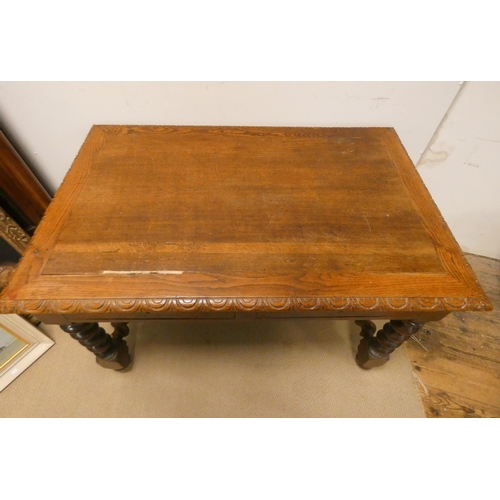 340 - An oak library or centre table with carved borders standing on barley twist base with cross stretche... 