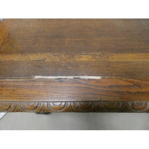 340 - An oak library or centre table with carved borders standing on barley twist base with cross stretche... 