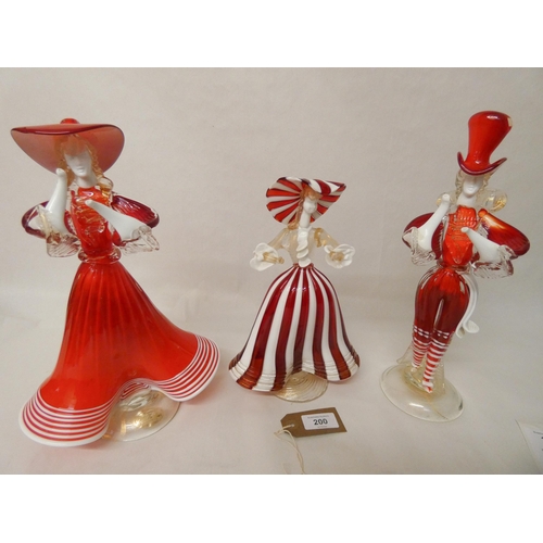 200 - A pair of vintage Murano glass lady and gent figurines and slightly smaller Murano glass figure in a... 