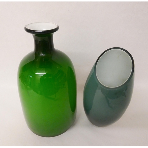 207 - Two pieces of handblown Art glass. Large green narrow necked bottle vase measures 28cm tall