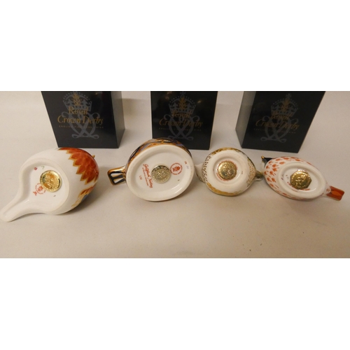 223 - A collection of four Royal Crown Derby paperweights of birds. Three boxed and the Goldfinch Nesting ... 