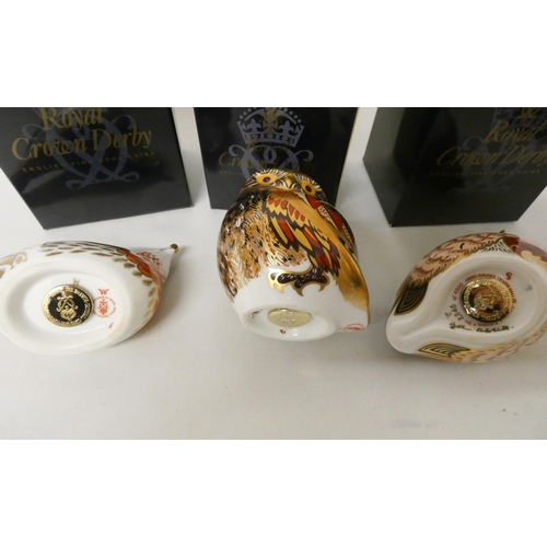 231 - A collection of three Royal Crown Derby paperweights. A Bluebird, a Partridge and a Little Owl