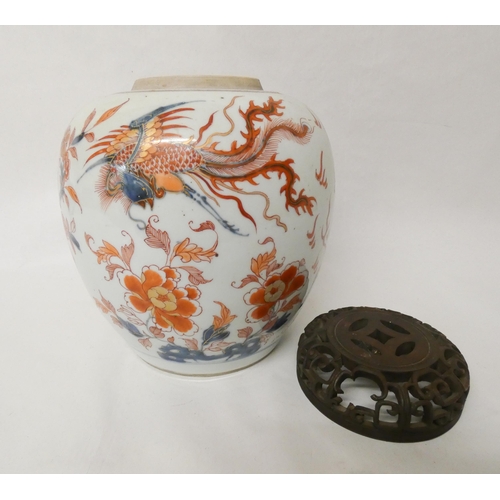 245 - An Imari ginger jar and cover with pierced hardwood lid, jar is 22 cms tall