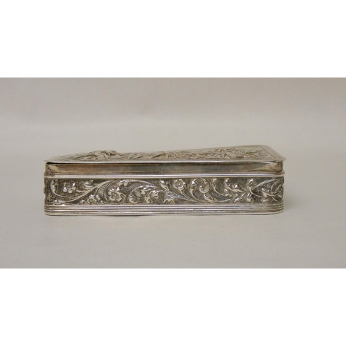 554 - A Dutch silver snuff box of rectangular form, the hinged lid embossed with village scene. Diameter 8... 