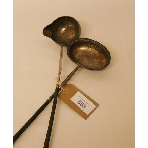 558 - Two antique silver brandy ladles with twisted treen handles