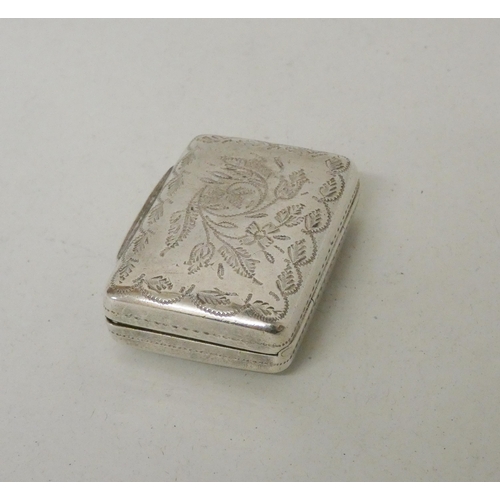 559 - An antique silver vinaigrette of rectangular form with floral engraving, gilded interior and grille.... 