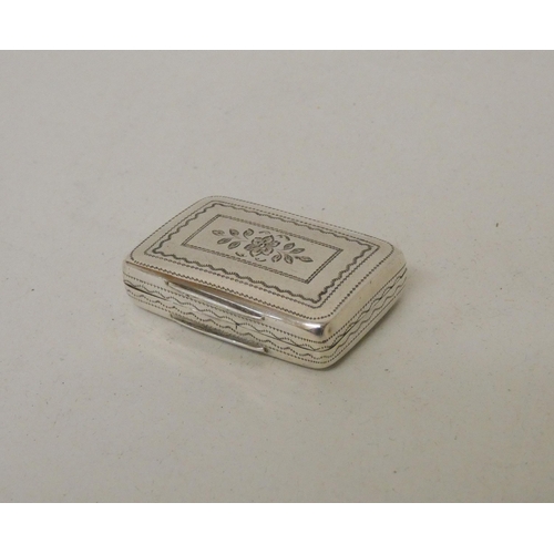 560 - A George III silver vinaigrette of rectangular form with  engraved decoration, gilded interior and g... 