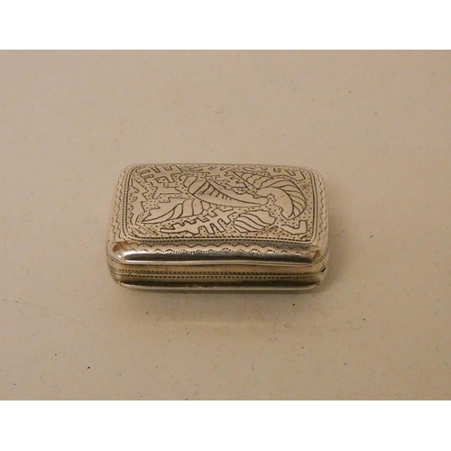 561 - A George III silver vinaigrette of rectangular form with floral engraving, gilded interior and grill... 