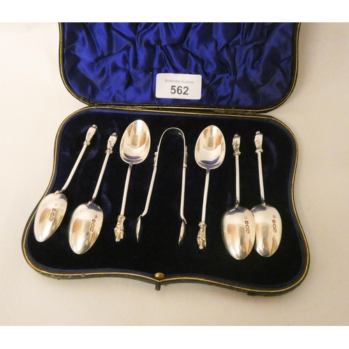 562 - A set of six Apostle ended silver teaspoons and pair of matching sugar nips in matching case