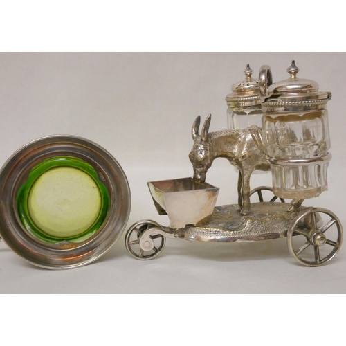 569 - A silver plated donkey cart cruet and an Art Nouveau green glass beaker in silver plated holder