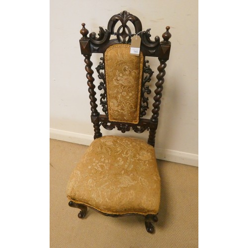 145 - A carved Victorian walnut occasional chair with barley twist columns standing on cabriole legs with ... 