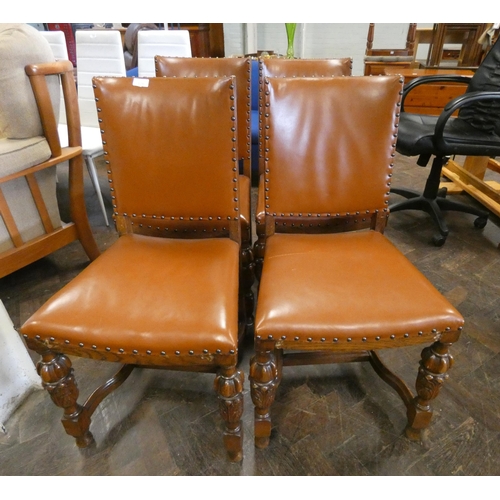 179 - A set of four good quality leather studded upholstered dining chairs on cup and cover carved & cross... 