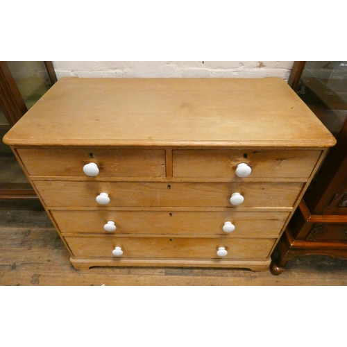 304 - A Victorian stripped and waxed pine chest of three long and two short drawers with bun handles. Mark... 