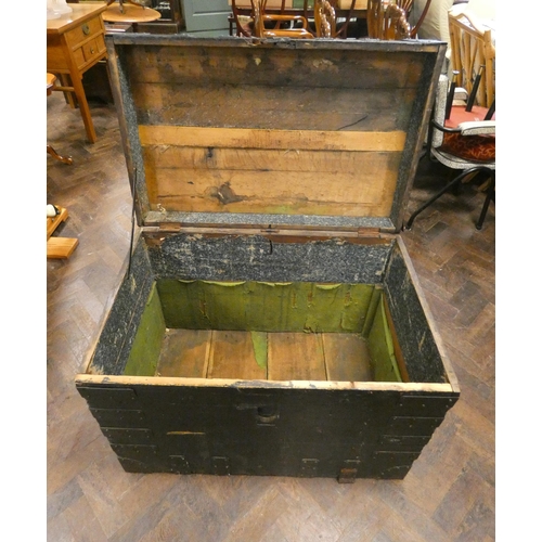 331 - A large heavy iron-bound trunk with carrying handle