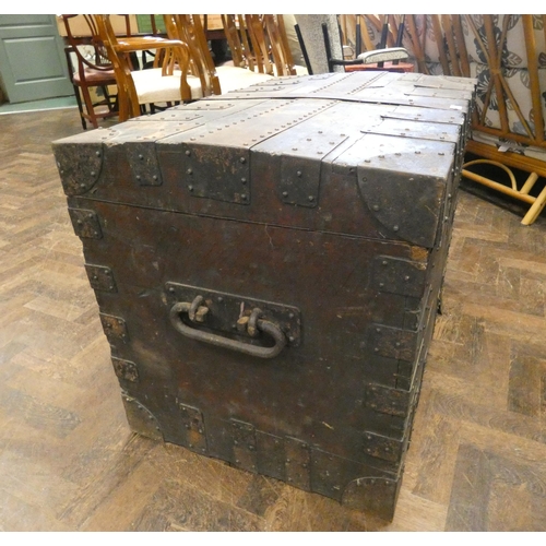 331 - A large heavy iron-bound trunk with carrying handle