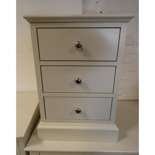 365 - A modern cream chest of two long and two short drawers, a matching dressing table with stool and a t... 