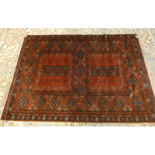 376 - A red and patterned Persian designed wool pile rug 6'6