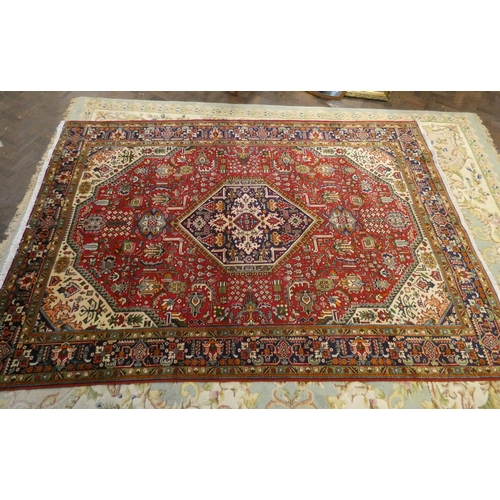 377 - A red and patterned wool pile Persian rug 10'x6'6