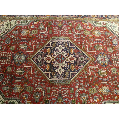 377 - A red and patterned wool pile Persian rug 10'x6'6