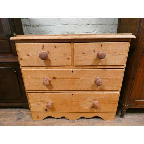 390 - A Victorian stripped pine chest of two long and two short drawers with bun handles. 35