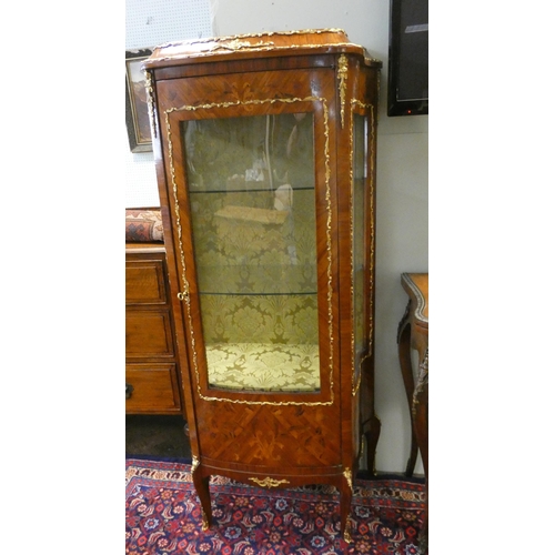 416 - A French Kingwood and marquetry inlaid shaped front china display cabinet with gilt metal mounts. 28... 