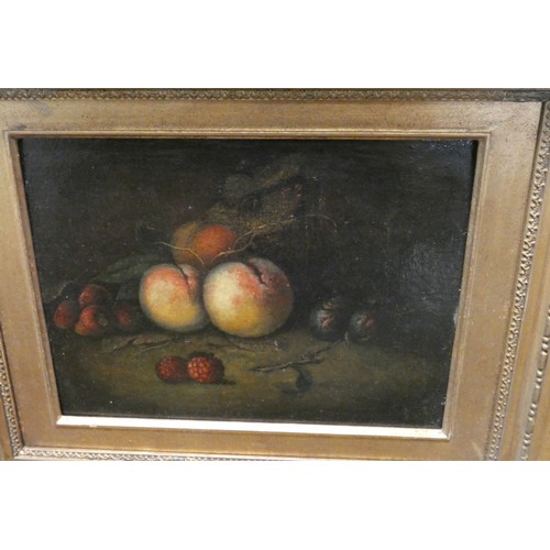 394 - A still life painting on panel of fruit in a gilt frame and a still life of flowers in a gilt frame