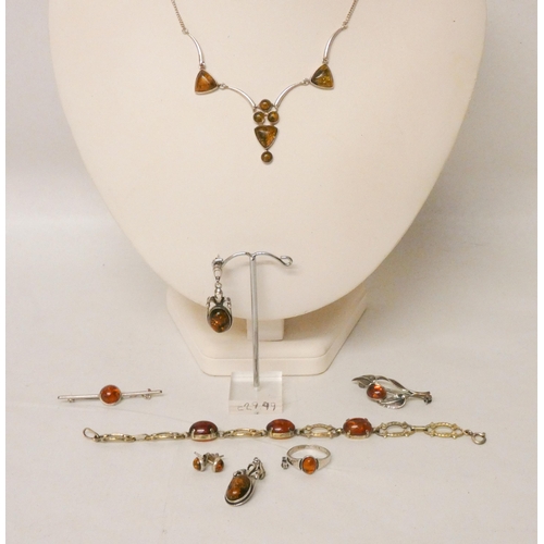 607 - A Silver and Amber necklace, brooches , pair of drop earrings etc.