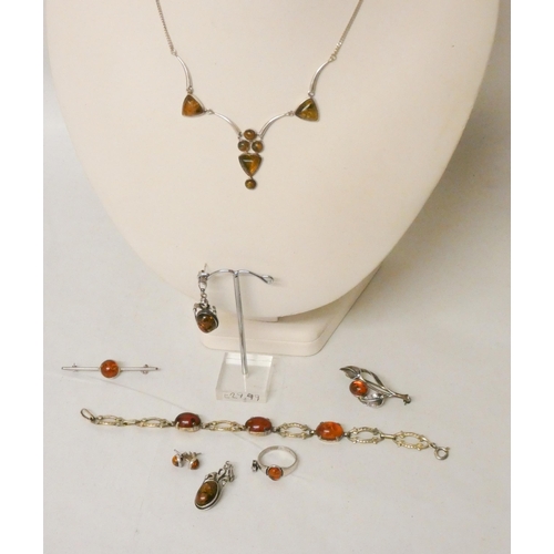 607 - A Silver and Amber necklace, brooches , pair of drop earrings etc.