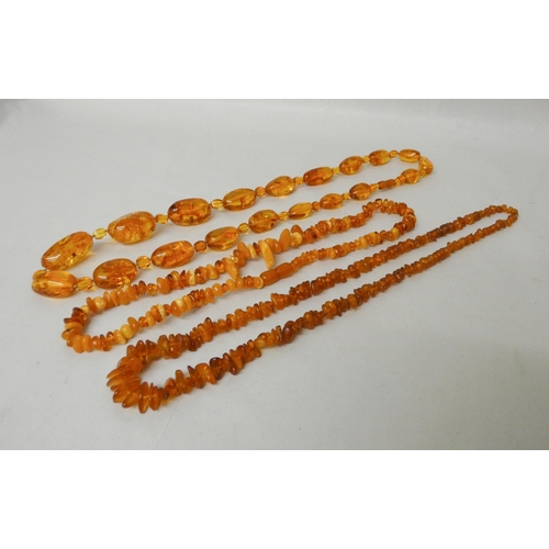 608 - A collection of three Baltic amber necklaces.