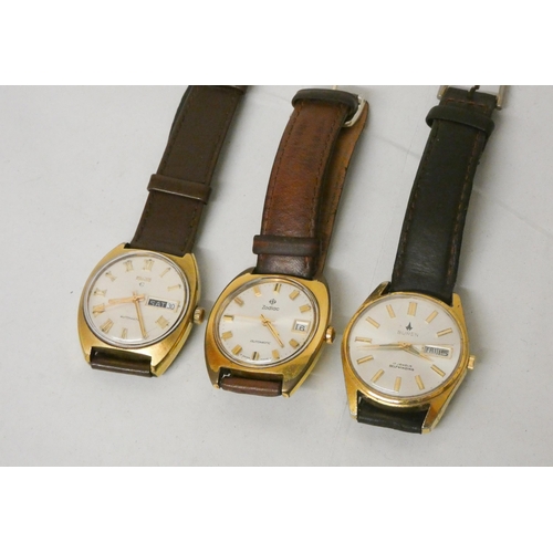 614 - A collection of three gents automatic wrist watches. By Elgin, Buren and Zodiac.