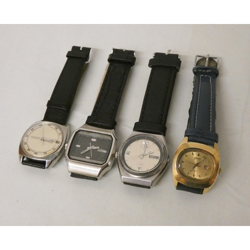 617 - A collection of four vintage gents watches, to include three automatic examples.