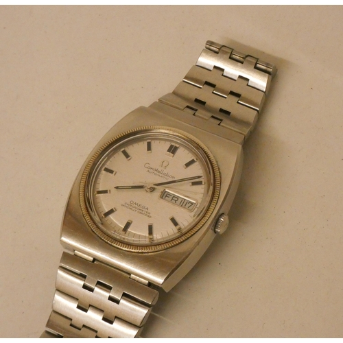 619 - An Omega Constellation automatic chronometer day-date wrist watch. Stainless steel strap and case.