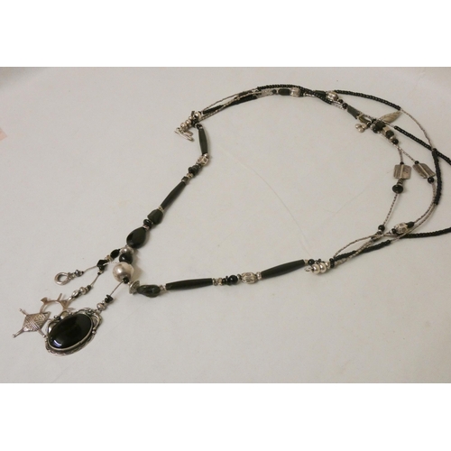 636 - A large multi strand black bead and silver necklace by Jaana