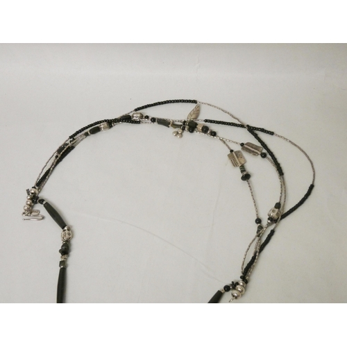 636 - A large multi strand black bead and silver necklace by Jaana