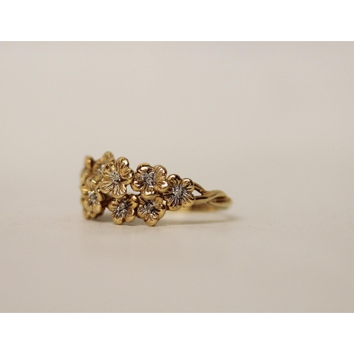 646 - A 14ct yellow gold and diamond flower cluster dress ring. Hallmarked. Ring size S. Gross weight 3.7g... 