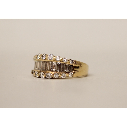 674 - A modern diamond half hoop band set with a central row of baguette cut diamonds, flanked with claw s... 