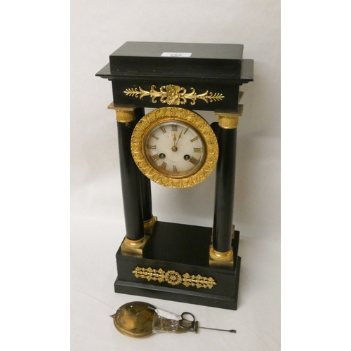 255 - A French empire striking mantel clock in an ebonised and gilt mounted case