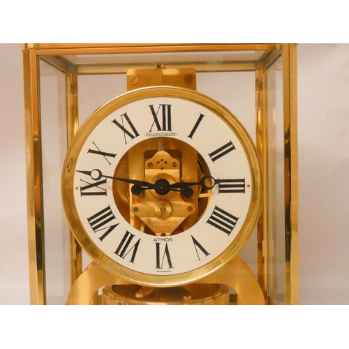 257 - A Jaeger-LeCoultre Atmos 15 jewels Swiss made mantel clock,  white finish chapter ring with Roman nu... 