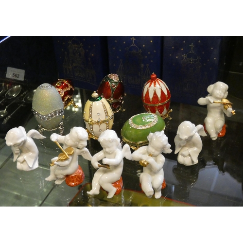 746 - Six collectors Faberge eggs with boxes together with six miniature porcelain German cherub figurines