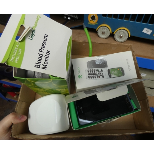 937 - A blood pressure monitor and one other, and two Doro mobile phones in boxes