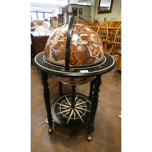 349 - A globe of the world cocktail cabinet with decorative black under tier