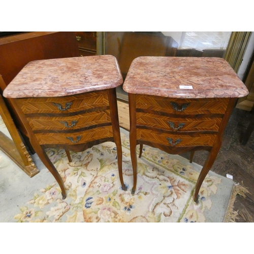 403 - A pair of French inlaid Kingwood three drawer bedside chests on cabriole legs with rouge marble tops... 