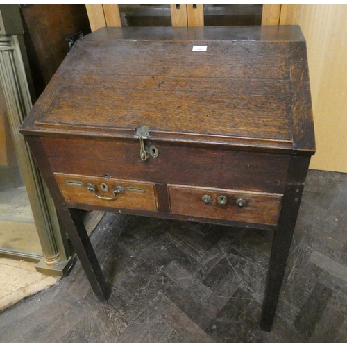 428 - An antique oak rent collectors bureau fitted interior drawers with two drawers under fitted with coi... 