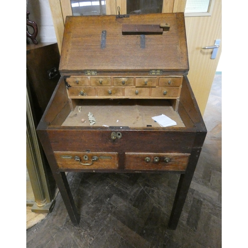 428 - An antique oak rent collectors bureau fitted interior drawers with two drawers under fitted with coi... 